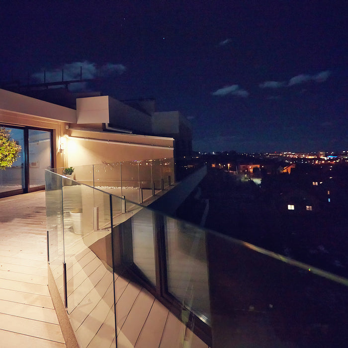 glass balustrade clamps - rooftop patio with glass balustrade