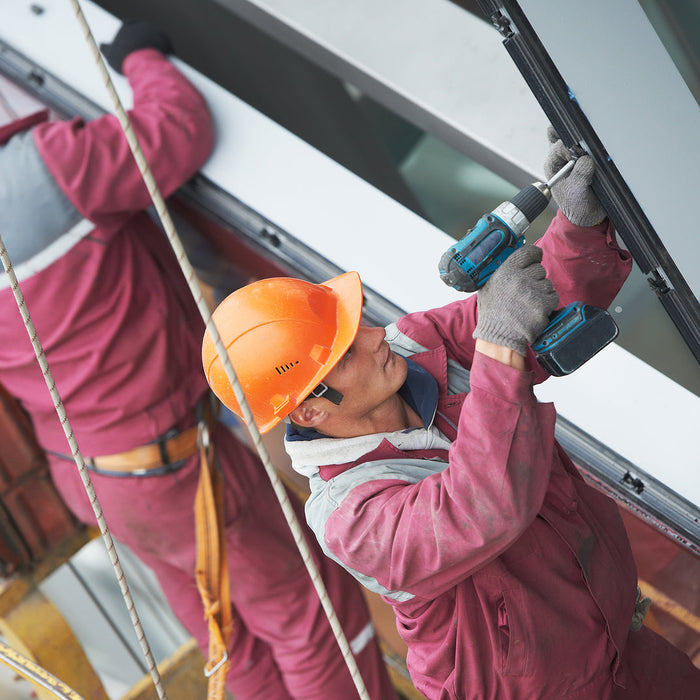 glass hardware - builders worker installing glass windows