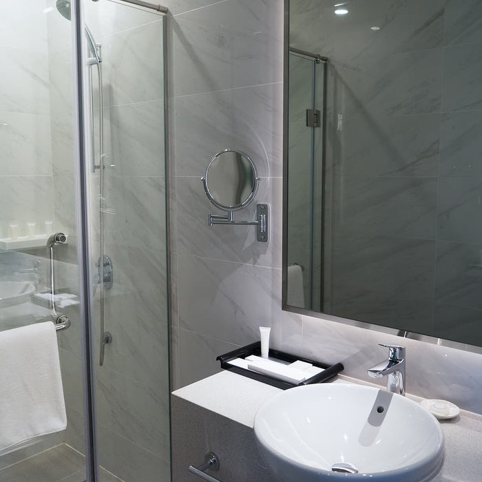 mirror wall fixings - Hotel bathroom with shower stall