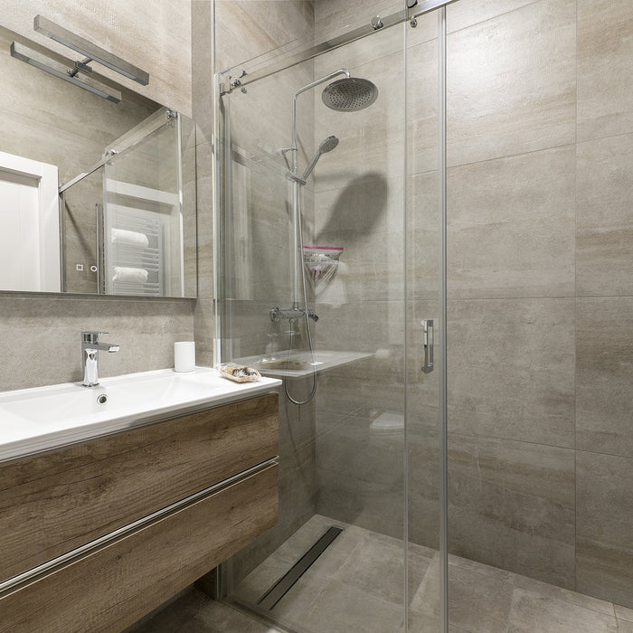 shower glass brackets - Bathroom with imitation marble tiles